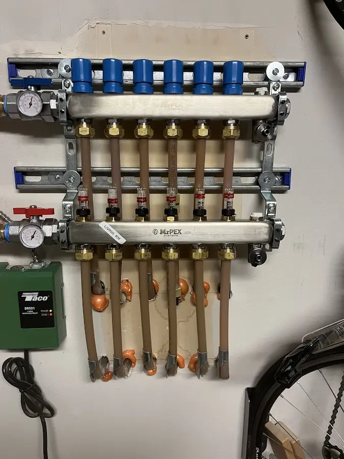 Plumber performing Water Heater Repair at a residential property in Peshtigo